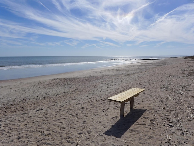 view of property's community featuring a view of the beach and a water view