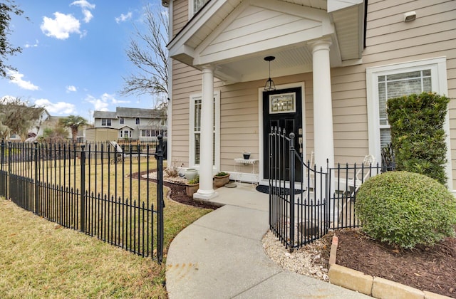 doorway to property featuring a yard