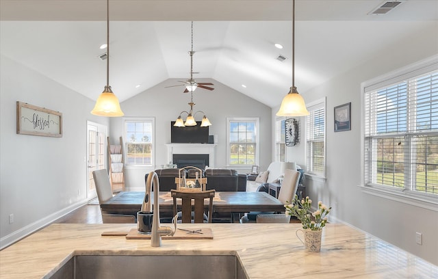 dining area with hardwood / wood-style flooring, sink, and plenty of natural light