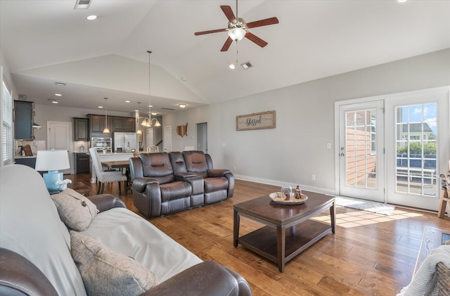 living room with light hardwood / wood-style flooring, high vaulted ceiling, and ceiling fan