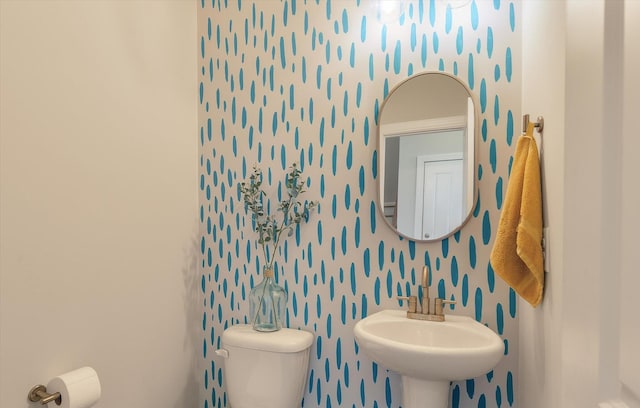 bathroom featuring sink and toilet