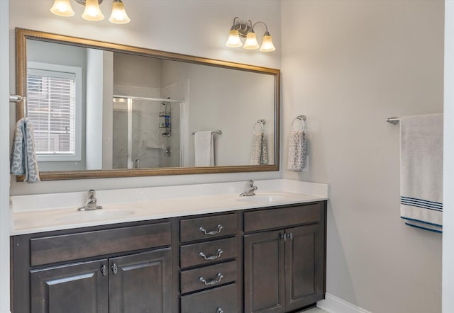 bathroom featuring vanity and an enclosed shower