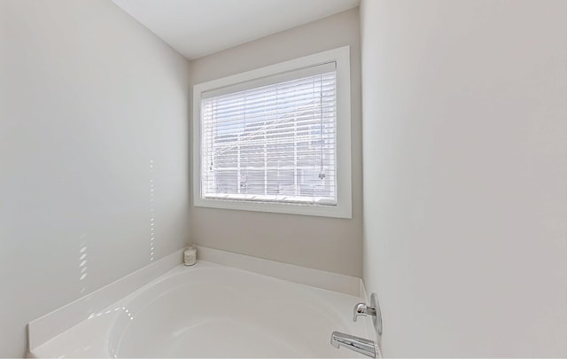 bathroom with a washtub