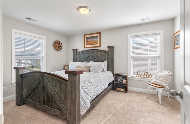 bedroom with light colored carpet