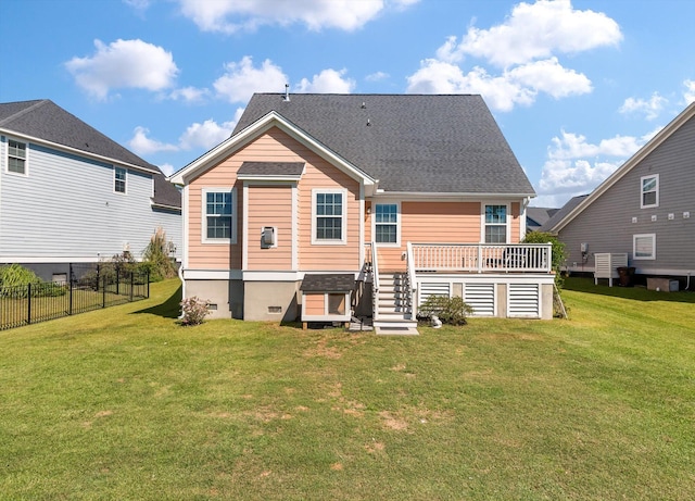 back of house featuring a wooden deck, central air condition unit, and a lawn