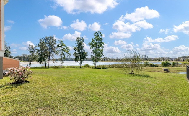 view of yard with a water view