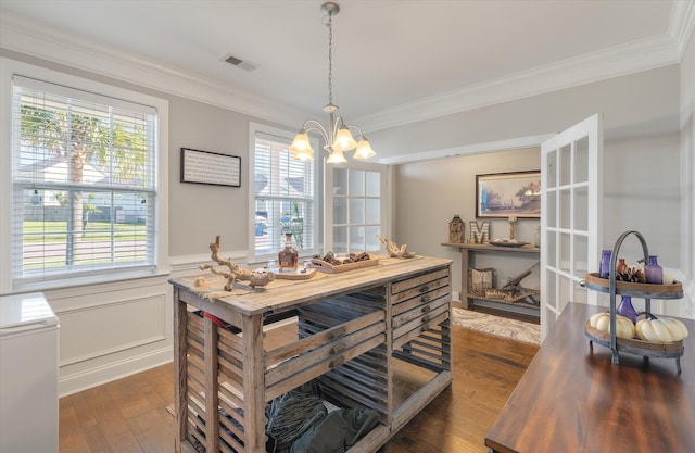 dining area with a wealth of natural light, crown molding, a notable chandelier, and dark hardwood / wood-style flooring