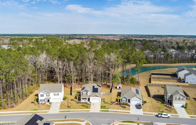 bird's eye view featuring a water view and a residential view