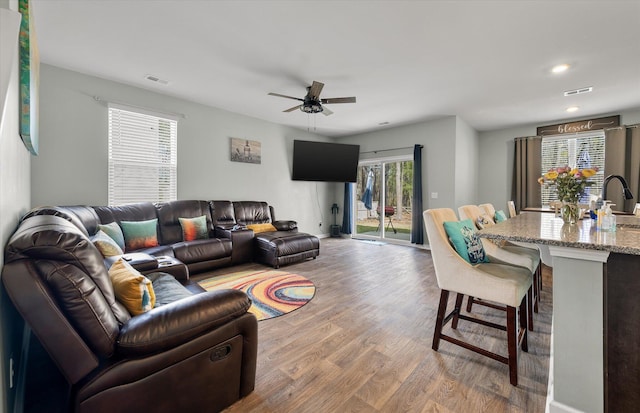 living area featuring visible vents, recessed lighting, ceiling fan, and wood finished floors