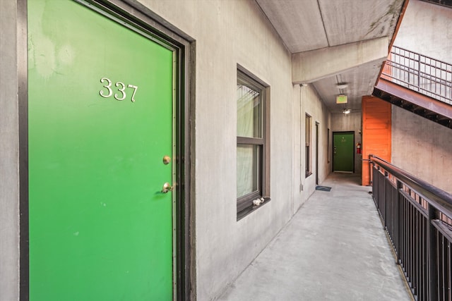 property entrance with stucco siding