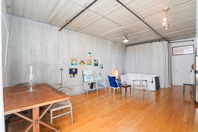 interior space with a ceiling fan and wood finished floors