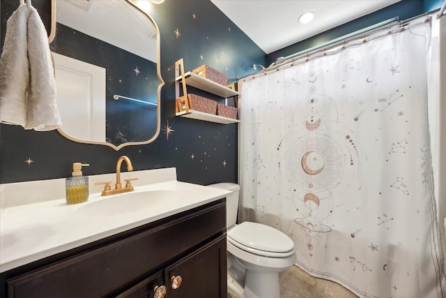 bathroom featuring vanity, a shower with shower curtain, toilet, and tile patterned floors