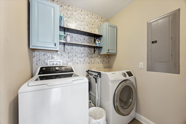 laundry area with wallpapered walls, baseboards, electric panel, cabinet space, and separate washer and dryer