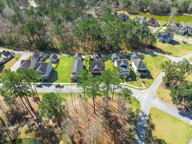 drone / aerial view with a residential view and a water view