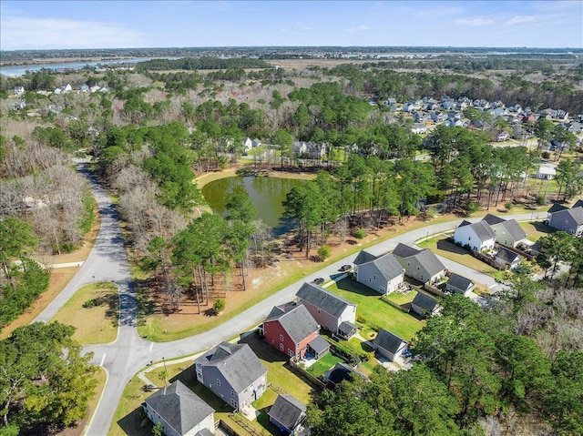 drone / aerial view featuring a residential view and a water view