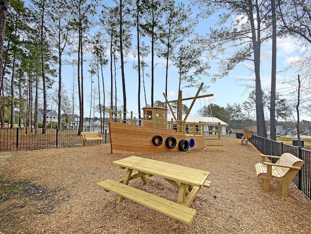 view of playground featuring fence