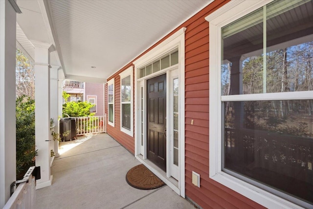 view of exterior entry with a porch