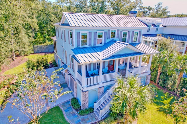 view of front of house featuring a balcony