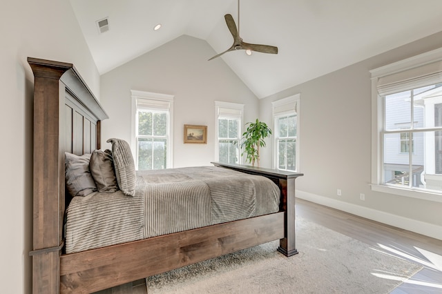 bedroom featuring ceiling fan, high vaulted ceiling, and light hardwood / wood-style floors