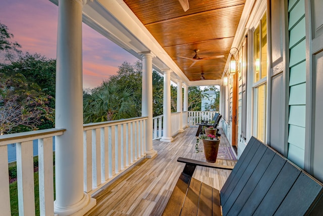 deck at dusk with ceiling fan