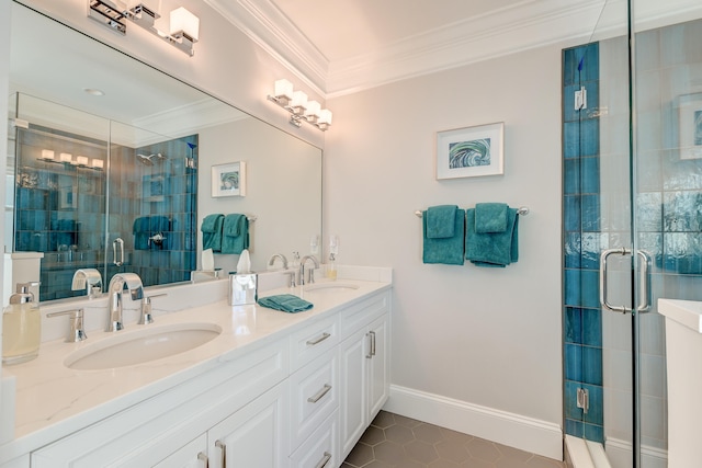 bathroom featuring tile patterned flooring, ornamental molding, an enclosed shower, and vanity