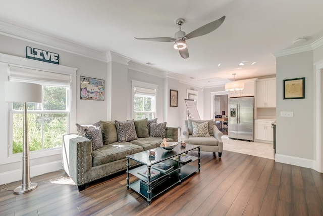 living room featuring ceiling fan, ornamental molding, and hardwood / wood-style floors