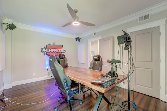 home office with ornamental molding, ceiling fan, and dark hardwood / wood-style flooring