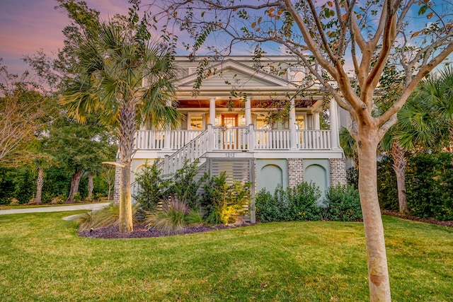 view of front of property featuring a yard and a porch