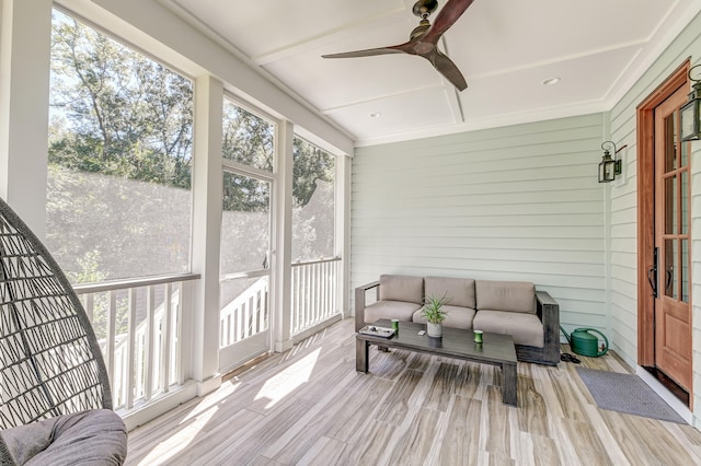 sunroom with ceiling fan