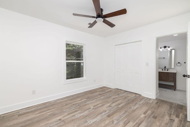 2924 Chicora Ave, North Charleston, SC 29405 - unfurnished bedroom featuring light wood-type flooring, a closet, ensuite bath, and ceiling fan