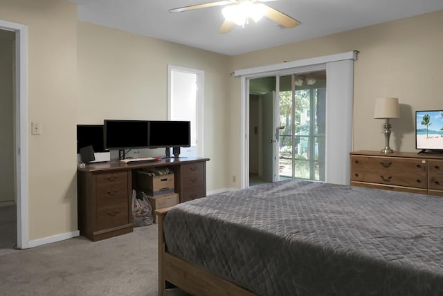 carpeted bedroom with ceiling fan and access to outside