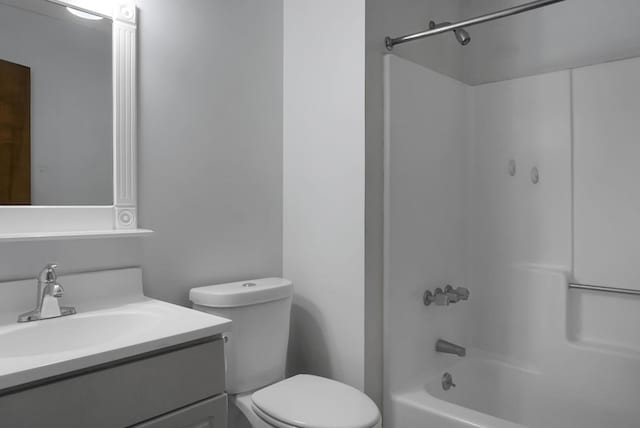 full bathroom with vanity, shower / bathtub combination, and toilet