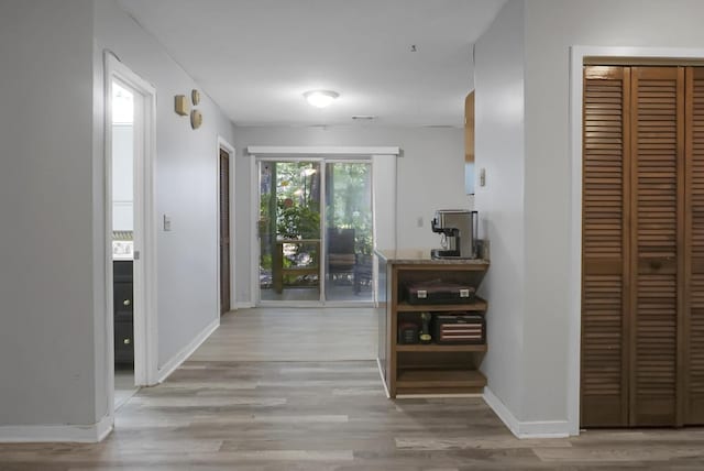 corridor featuring light wood-type flooring