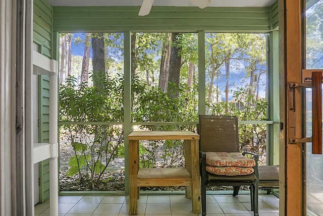 sunroom with plenty of natural light and ceiling fan