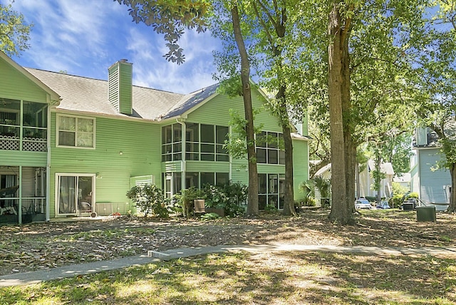 back of property featuring a sunroom