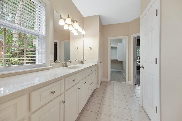 bathroom with tile patterned flooring and vanity