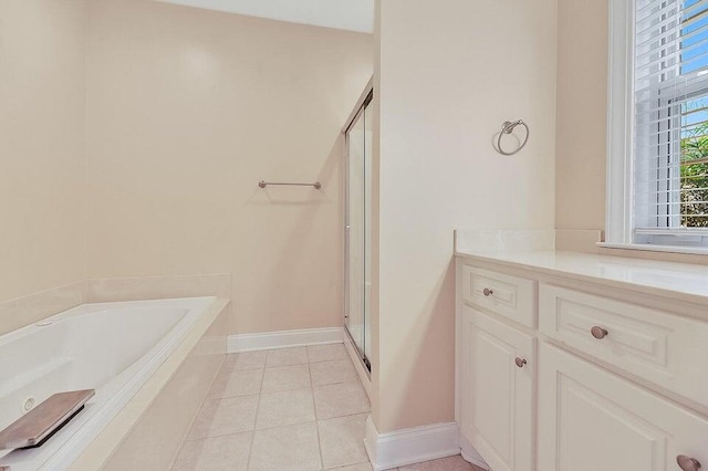 bathroom featuring separate shower and tub and tile patterned flooring