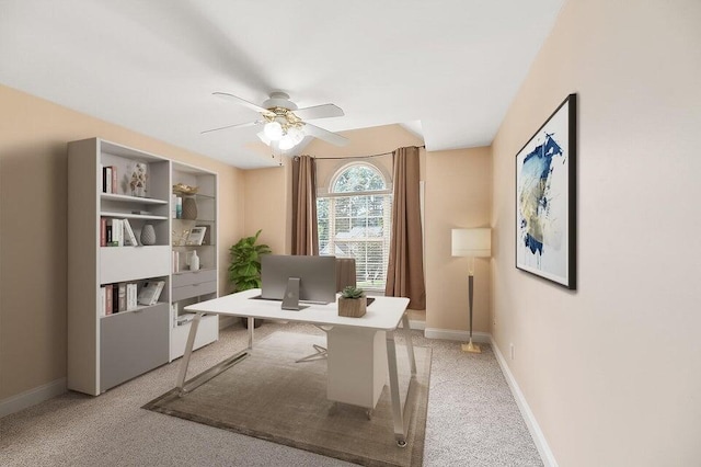 office area with light carpet and ceiling fan