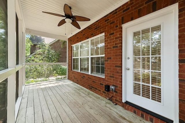 wooden deck featuring ceiling fan and covered porch