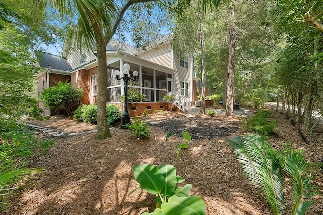 exterior space with a sunroom