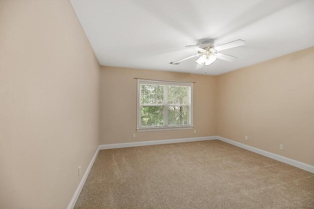 empty room with ceiling fan and carpet flooring