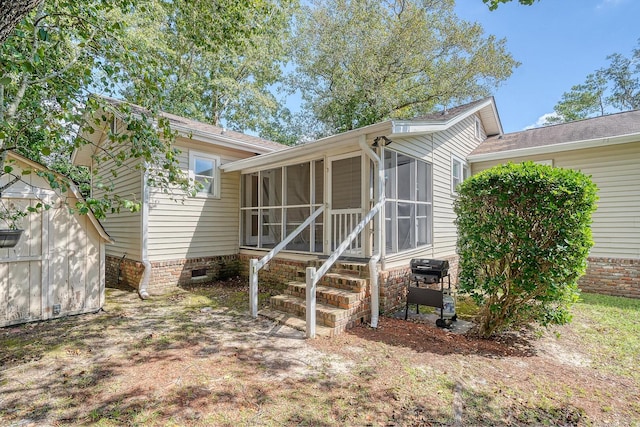 back of house with a sunroom