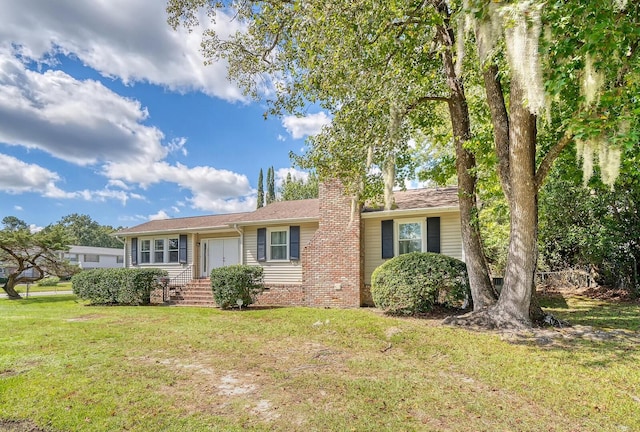 ranch-style home with a front lawn