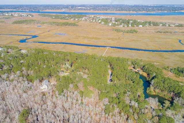 birds eye view of property with a wooded view