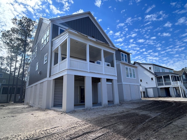 view of front of property featuring board and batten siding and a balcony