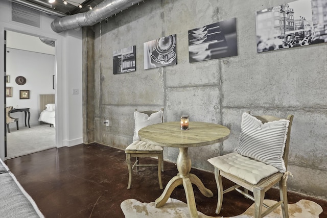 dining room featuring visible vents and finished concrete flooring