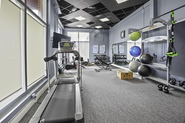 workout area featuring a paneled ceiling