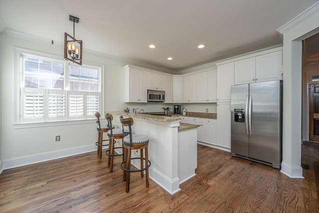kitchen featuring dark wood-type flooring, white cabinets, and stainless steel appliances