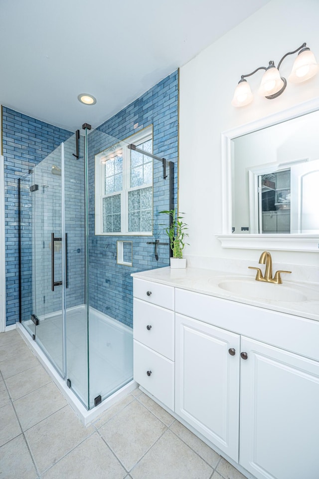 full bath featuring recessed lighting, tile patterned floors, a shower stall, and vanity