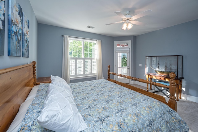 bedroom with visible vents, a ceiling fan, and baseboards